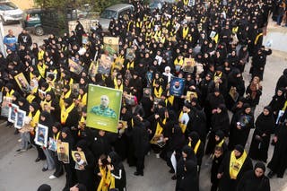 Mourners attend the funeral of people, including Hezbollah members, who were killed during the conflict with Israel before a 10-day ceasefire between Lebanon and Israel went into effect, in Kfar Sir, Lebanon, April 21, 2026.